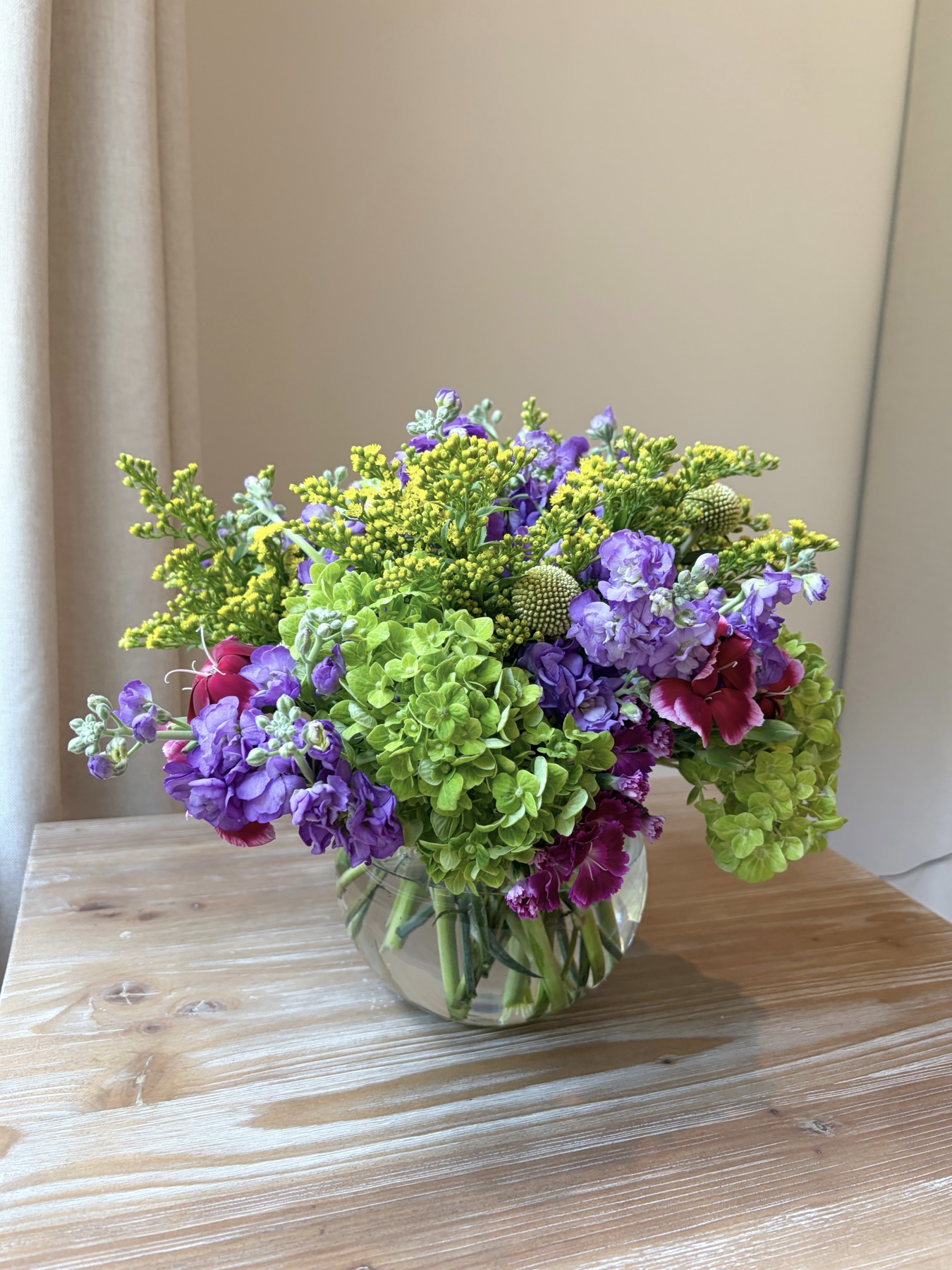 Purple and green wildflower arrangement