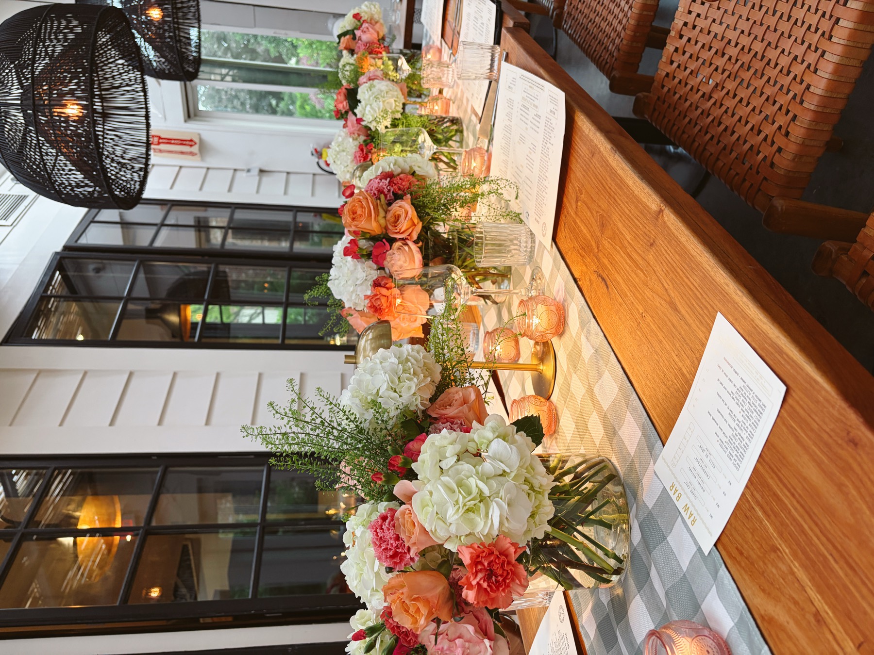 Peach roses and white hydrangea arrangement on a table